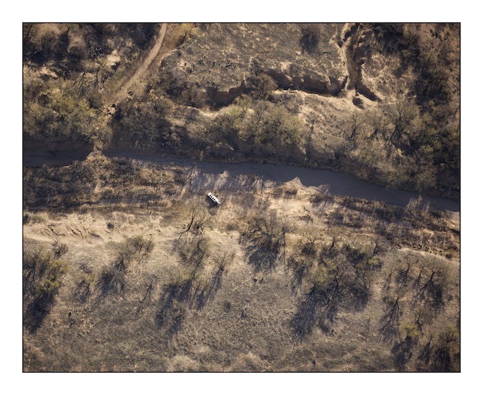  An overturned migrant vehicle in a dried river bed in the Altar Valley near Sasabe in Southern Arizona. Coyotes - the name given to human and drug traffickers - pick migrants up in pre-arranged locations in the desert and then drive them further into Arizona and the United States. Sometimes the vehicles are seen by the United States Border Patrol who chase them through the desert. The coyotes frequently crash their poorly equipped vehicles in the dark. &nbsp; 